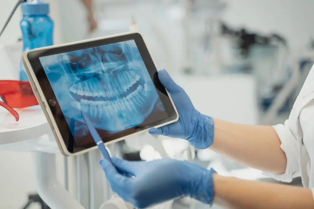 dentist assessing panoramic radiograph